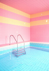 Bright and colorful indoor swimming pool featuring pink and blue tiles with a ladder