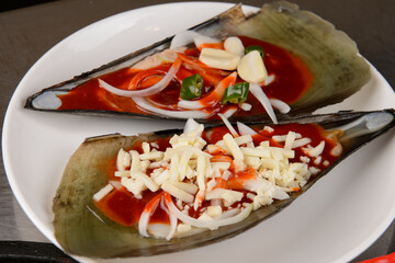 Grilled clams topped with cheese and Korean red pepper paste
