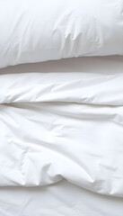 Obraz premium close up of a bed with white sheets and pillows