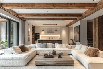 Modern living room with white and dark wood accents, open-concept design, large grey couches, elegant coffee table, and kitchen with stainless steel appliances.