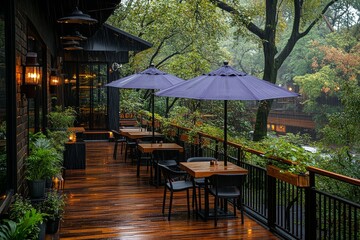 Fototapeta premium Outdoor terrace with tables, chairs, purple umbrella, wet floor, and urban landscape with green trees and modern architecture.