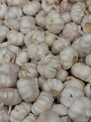 Close-up of garlic heads at a street market