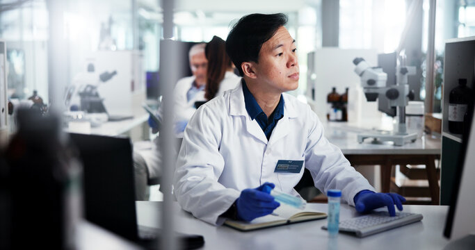 Man, scientist or vial with computer for experiment, medical research or test results at laboratory. Male person, science or reading with sample on technology for scientific trial, exam or chemistry