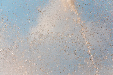 Splashes and jets of water against light background.