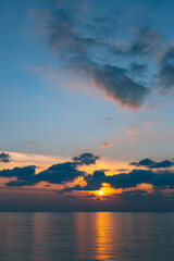 A Serene and Calm Sunset Over the Tranquil Ocean Waters