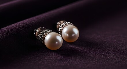Pearl earrings resting on plush purple velvet, a symbol of refined elegance and timeless sophistication.