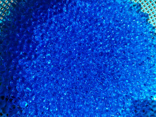 A close up of a blue plastic ball on a table