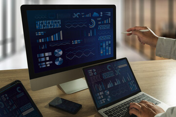 The business analyst used a laptop to analyze financial statistics, creating a digital dashboard for marketing performance reports..