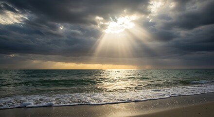 Sunbeams pierce through stormy clouds over the ocean beach