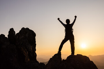 Woman climber success silhouette in mountains, achievement inspiration, Concept motivation and goal achievement.