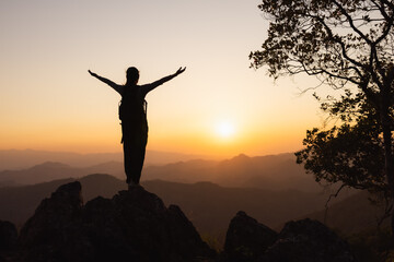 Woman climber success silhouette in mountains, achievement inspiration, Concept motivation and goal achievement.