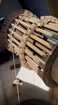 A large metal object with a chain attached to it