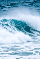 person riding a wave on top of a surfboard