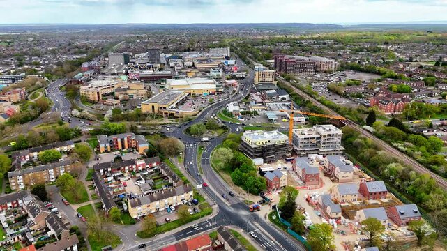 Reverse aerial view of Basildon town centre with a new development near the train station
