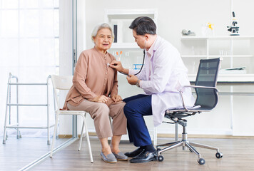 Asian doctor consultation, consultation checkup healthcare to retired old woman in clinic hospital diagnosis checking heart health listen patient heartbeat advice medical professional support medicine