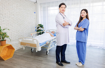 Obraz premium Portrait of asian confident male doctor in white coat standing with nurse at clinic hospital smiling looking at camera, Consultation caregiver support healthcare medicine wellness professional