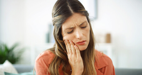 Woman, sore mouth and toothache at house from dental cavity, tooth extraction and gum infection....