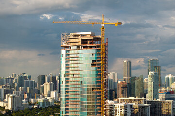 Skyscraper construction in Miami, Florida. USA real estate development. Big city urban landscape with high-rise buildings © bilanol