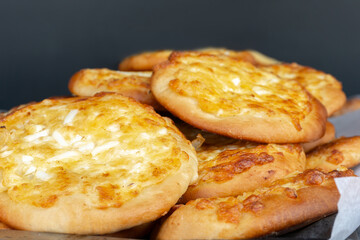 Freshly baked flatbreads with eggs on a large tray