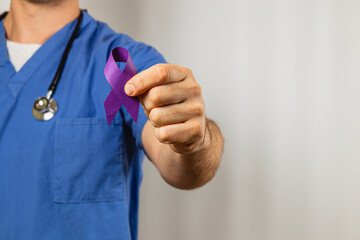 Healthcare professional promotes awareness with purple ribbon