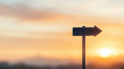 A wooden signpost pointing right against a soft, colorful sunset backdrop evokes a sense of direction and adventure. - obrazy, fototapety, plakaty