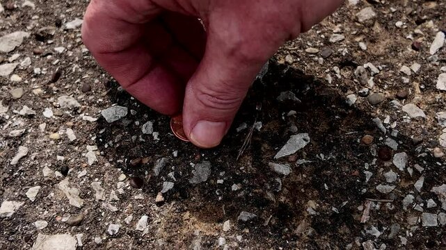 Picking up penny from ground