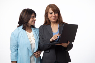 Indian corporate women working on laptop on white background