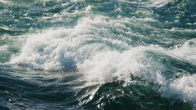 Immerse yourself in the enchanting beauty of nature through a collection of stunning shots capturing the majestic ocean waves, elegantly showcasing their immense power and graceful, fluid movement