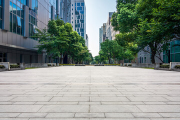 Serene Urban Pathway Surrounded by Modern Architecture and Lush Greenery