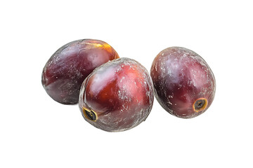 Obraz premium A close up of three shiny dates on a black background in a studio setting with soft lighting