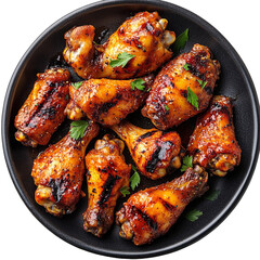Extreme top view of an extremely perfect looking grilled chicken wings in a dark plate isolated on a white transparent background