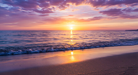 Obraz premium Sunset over a Calm Beach