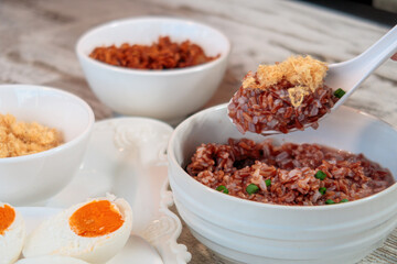 Rice porridge with salted eggs and shredded pork, healthy eating