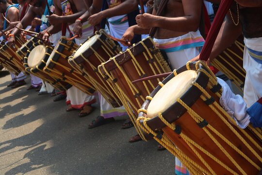 Chenda is a traditional percussion instrument originating from Kerala, India, used in temple rituals, classical dance forms like Kathakali, and other cultural festivities. It's a cylindrical drum