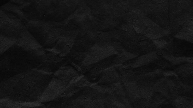 looping black crumpled paper background  texture.background paper texture stop motion animation