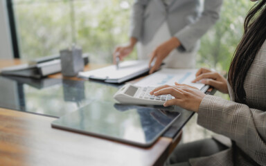 Two business people teamwork discussing documents and ideas