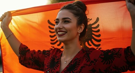Albanian pride: Young woman celebrating with the national flag outdoors