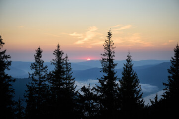 Beautiful morning view of mountains at sunrise. Amazing mountain landscape with colorful vivid...