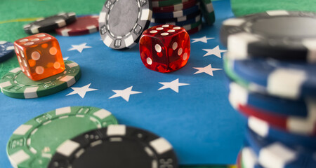 Casino background. Roulette table Chips. Casino theme. High contrast image of casino roulette, poker game, dice game, poker chips on a gaming table. flag of the European Union