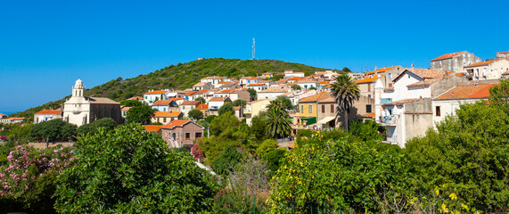 Fototapeta premium Greek church Saint-Spyrido, Cargèse, Corsica, France. Typical and picturesque hillside village. Hilltop town nestled on the coast above the Mediterranean sea.