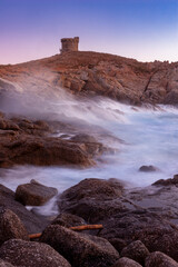 Omigna Genoese tower, in the Corsican maquis, Cargèse, Corsica island, France. Typical tower in tourist trail on the Mediterranean Corsican coast.