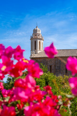 Obraz premium Latin church, in Cargèse, Corsica, France. Typical and picturesque hillside village. Hilltop town nestled on the coast above the Mediterranean sea.