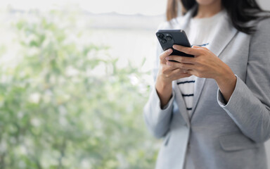 business woman use the smartphone. business successful technology concept
