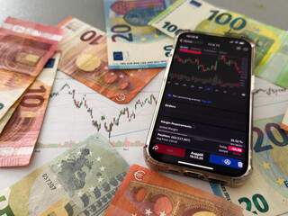 Crypto trader investor broker using cell phone app executing financial stock trade market trading order to buy or sell cryptocurrency shares thinking of investment risks profit concept.