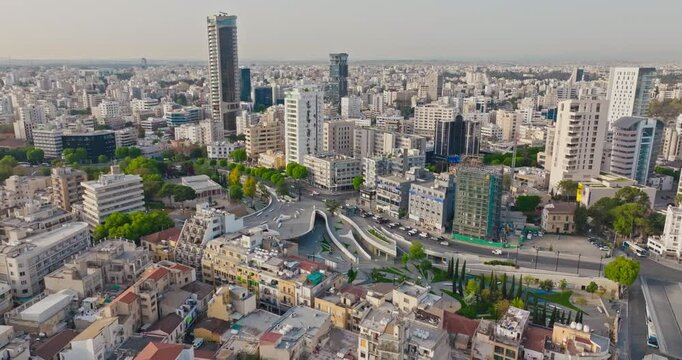 Aerial view cityscape of Nicosia Cyprus. Capital city modern architecture with skyscrapers on the island traffic on multi-level transportation. High quality 4k footage