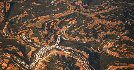 Surrounding Areas Of Santai County, China. View From Airplane Window On Landscape Of China. Porthole View Or Called Bull's-eye Window. Aerial View On Fields And Forests. Many Houses And Stadium. Dense