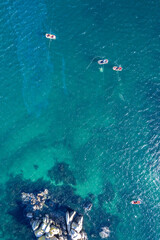Tranquil ocean scene, High angle view of boats on sparkling turquoise. top down drone photo