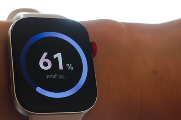 Man working and Installing update process with gearbox percentage progress and loading bar on smart watch