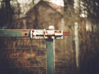 Homemade old latch on a fence in Russia