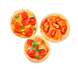 Different tasty mini pizzas on white background